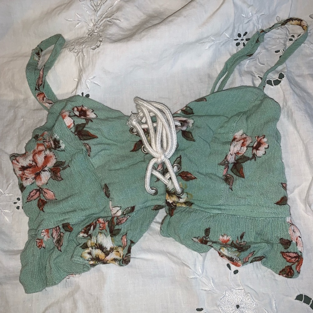 Two piece set. Flowey shorts. Tight fitting shirt with cleavage.